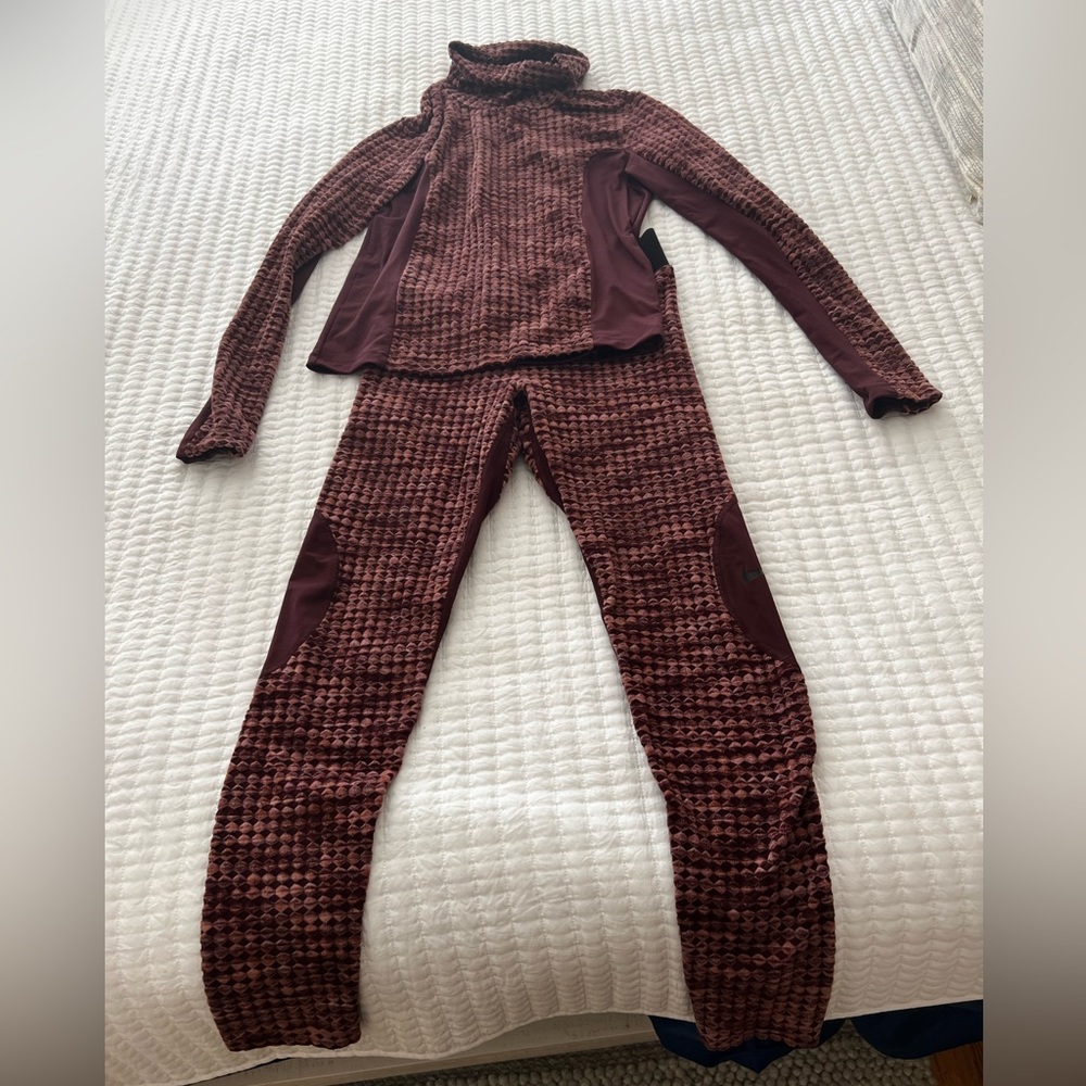 Nike cold weather top and bottom. Top is M pants are L. Never worn. Like new!